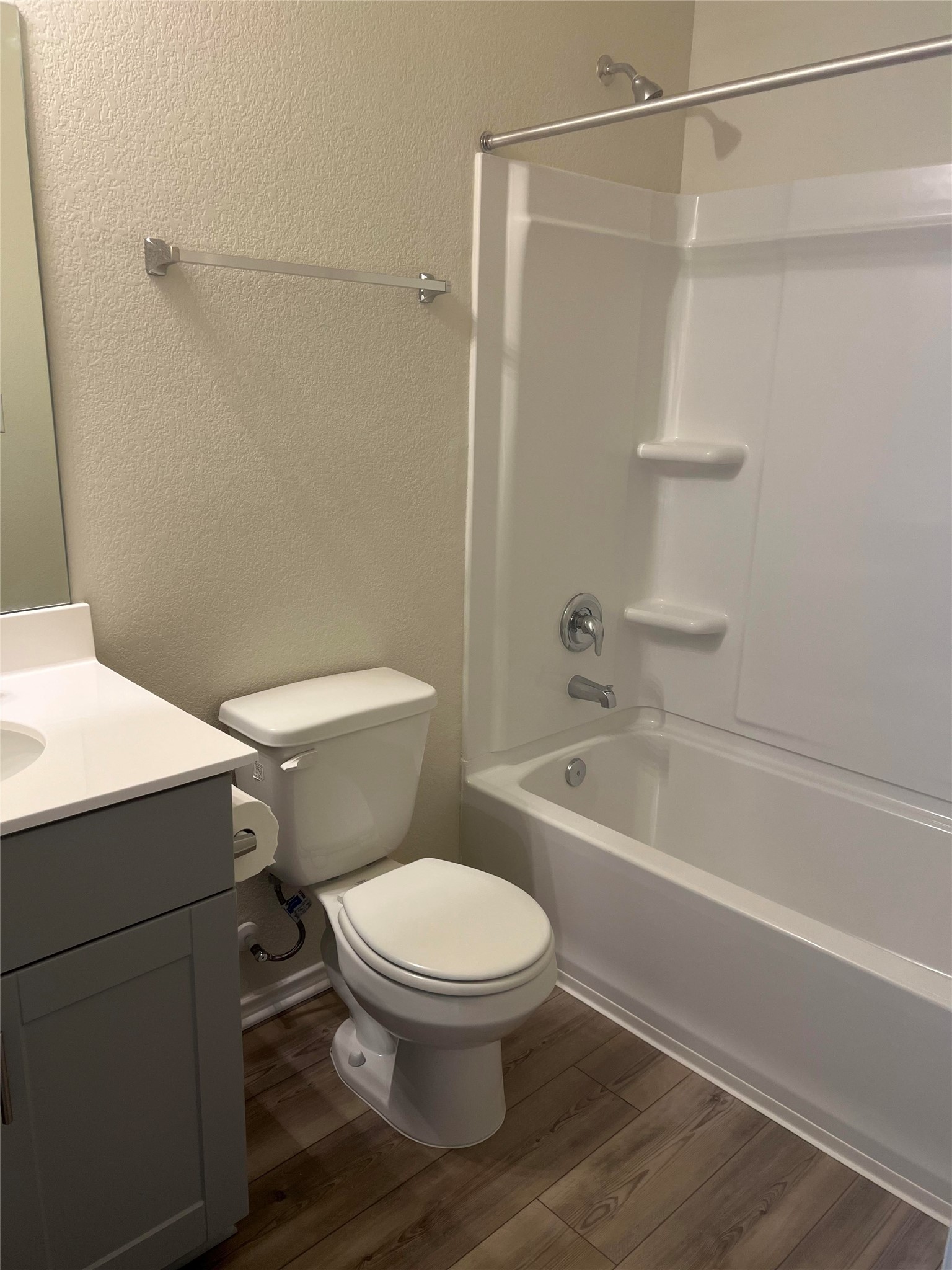 427 Tree Nut Loop Buda, TX 78610 - Photo 23 of 38 a white toilet sitting next to a bath tub and a shower