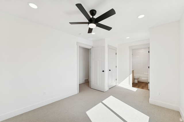 252 North Main Street Bountiful, UT 84010 - Photo 24 of 34 Unfurnished bedroom featuring light colored carpet, a closet, a ceiling fan, recessed lighting, and ensuite bathroom
