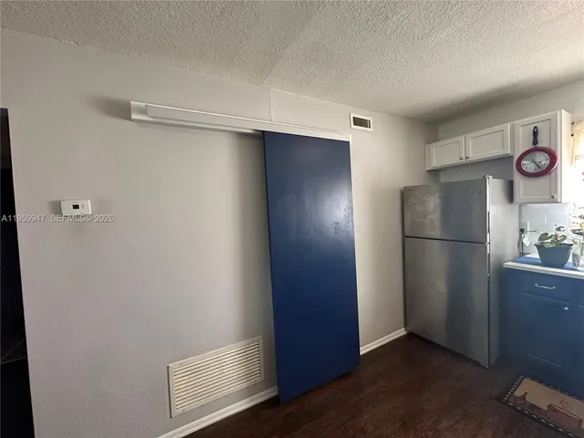 a bathroom with a sink mirror vanity and toilet