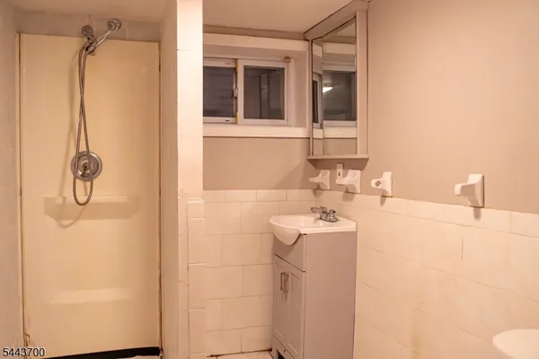 a bathroom with a sink and mirror