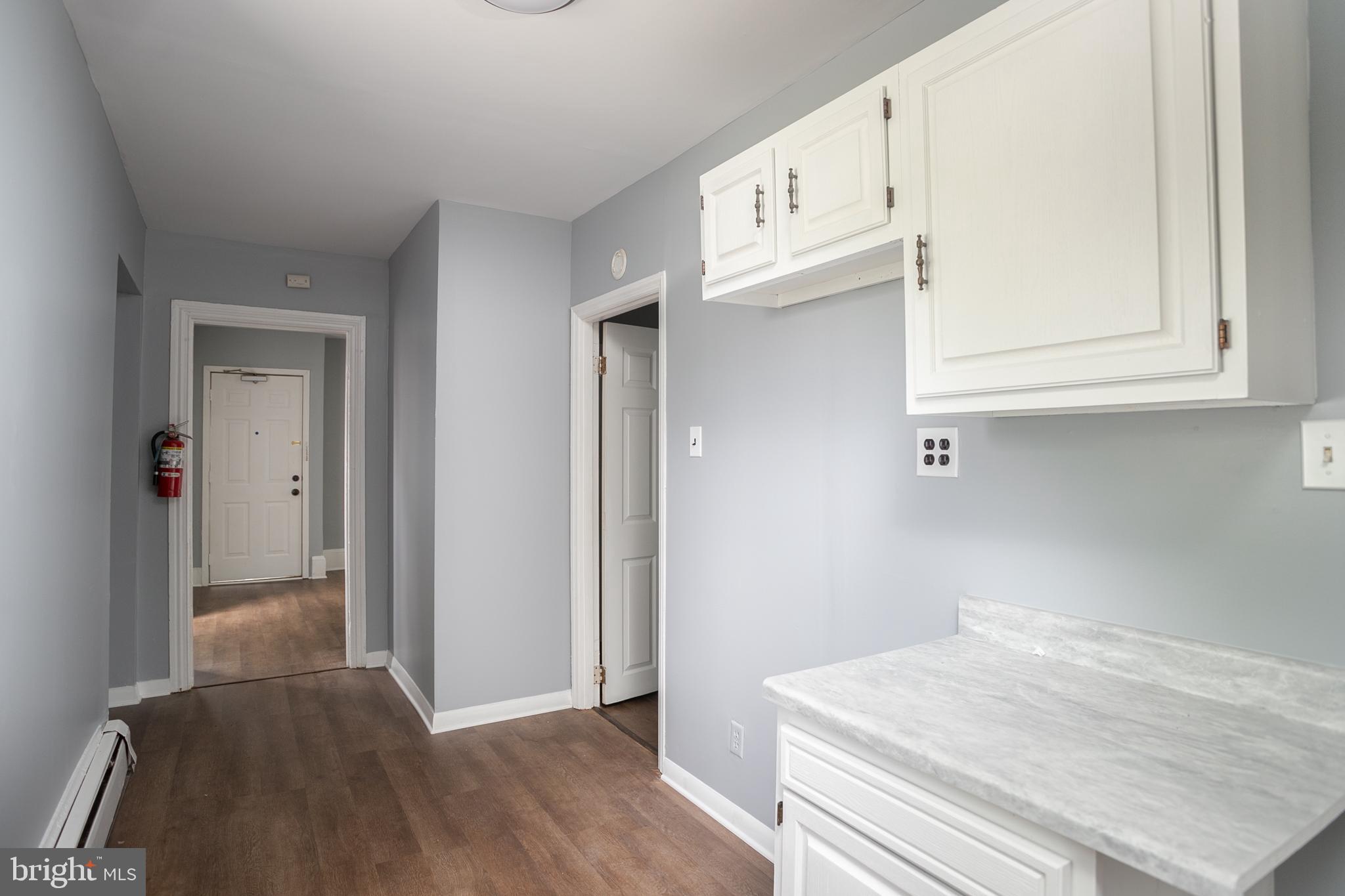 117 East Walnut Avenue, Unit E Merchantville, NJ 08109 - Photo 11 of 22 a view of kitchen with wooden floor
