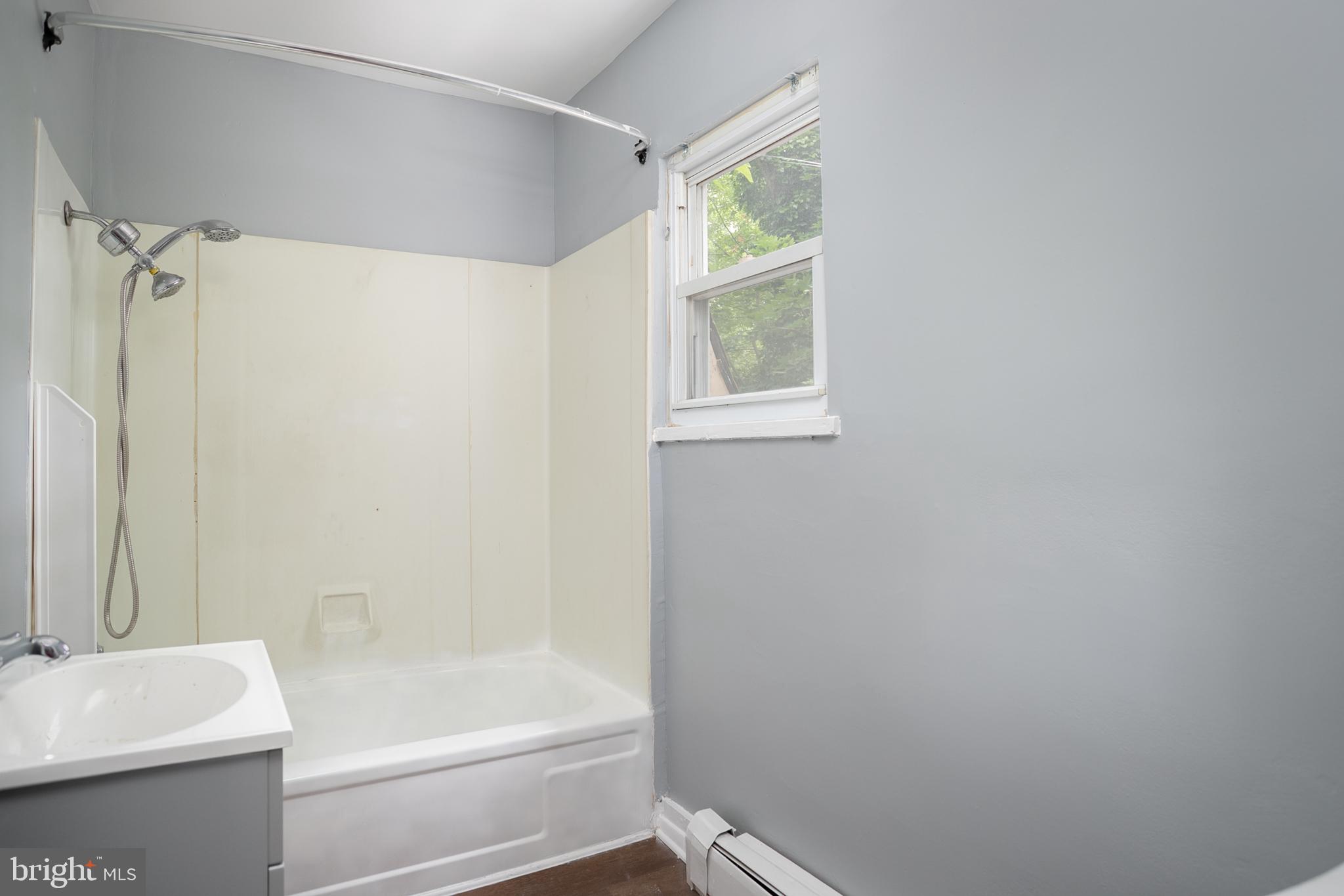 117 East Walnut Avenue, Unit E Merchantville, NJ 08109 - Photo 14 of 22 a bathroom with a bathtub and a sink