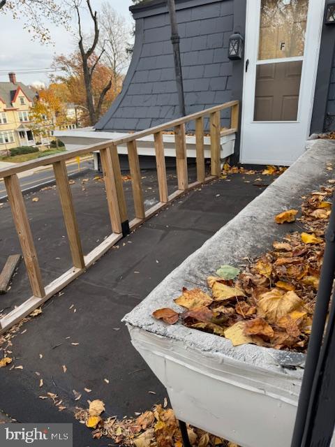 117 East Walnut Avenue, Unit E Merchantville, NJ 08109 - Photo 19 of 22 a view of a balcony with wooden floor