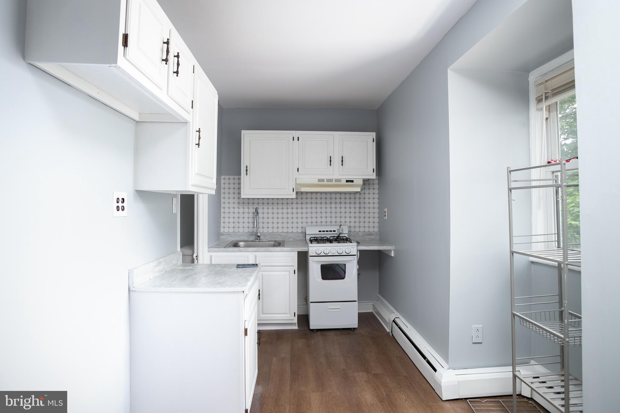 117 East Walnut Avenue, Unit E Merchantville, NJ 08109 - Photo 10 of 22 a kitchen with a sink cabinets and stainless steel appliances