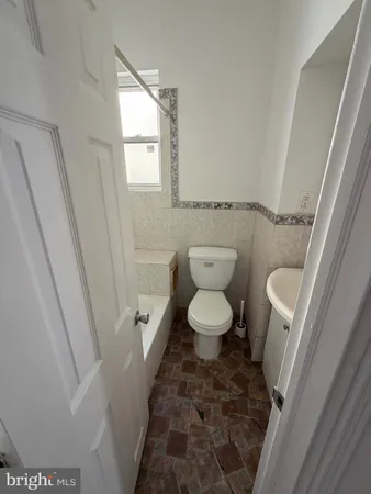 a bathroom with a sink and a toilet