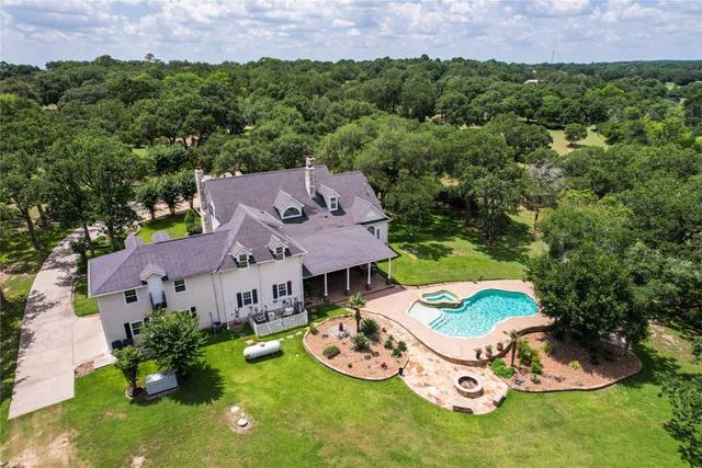 an aerial view of a house with garden