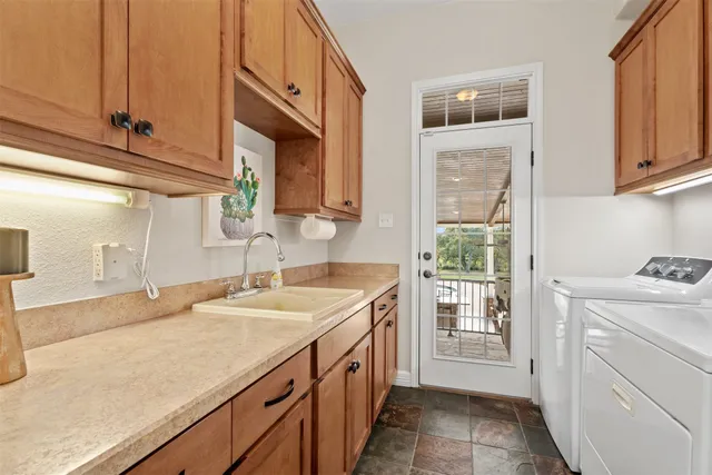 a kitchen with a sink and cabinets