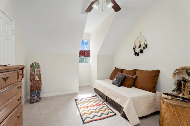 a bedroom with a bed and cabinets