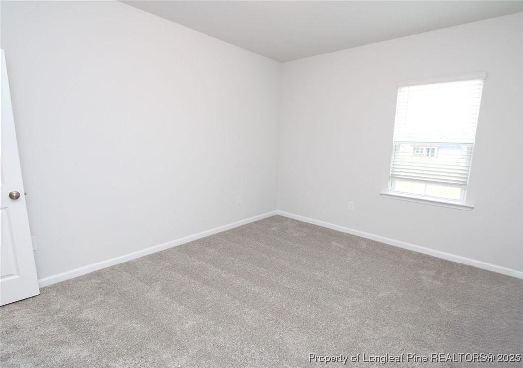 461 Grange Farm Place Raleigh, NC 27603 - Photo 13 of 50 an empty room with a window