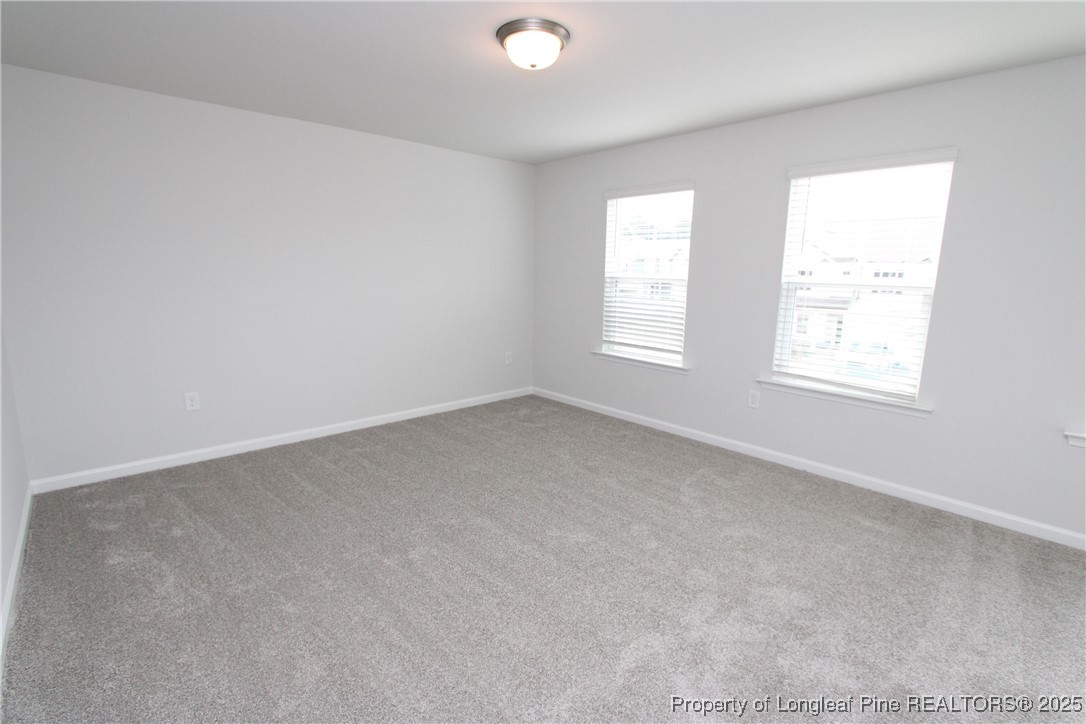 461 Grange Farm Place Raleigh, NC 27603 - Photo 31 of 50 an empty room with windows