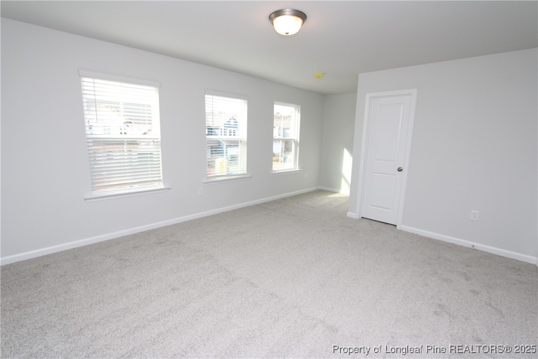461 Grange Farm Place Raleigh, NC 27603 - Photo 32 of 50 an empty room with windows