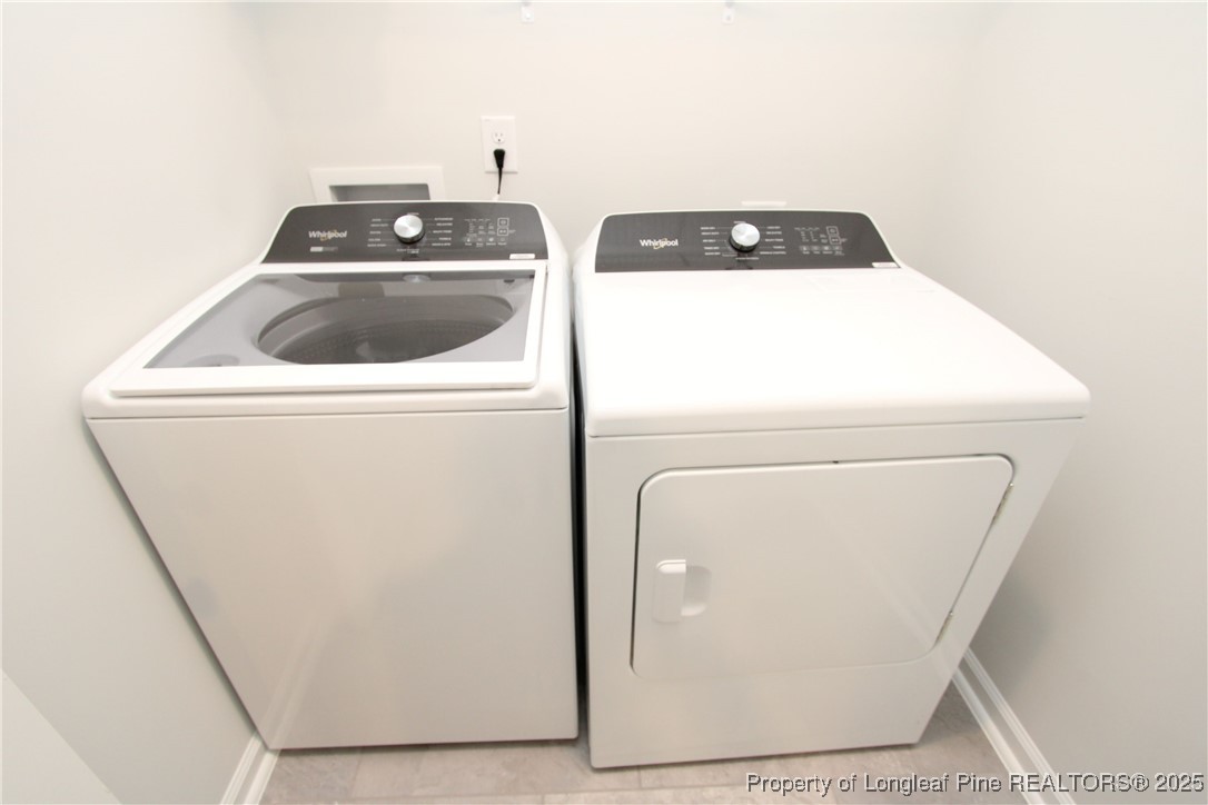 461 Grange Farm Place Raleigh, NC 27603 - Photo 40 of 50 a utility room with dryer and washer