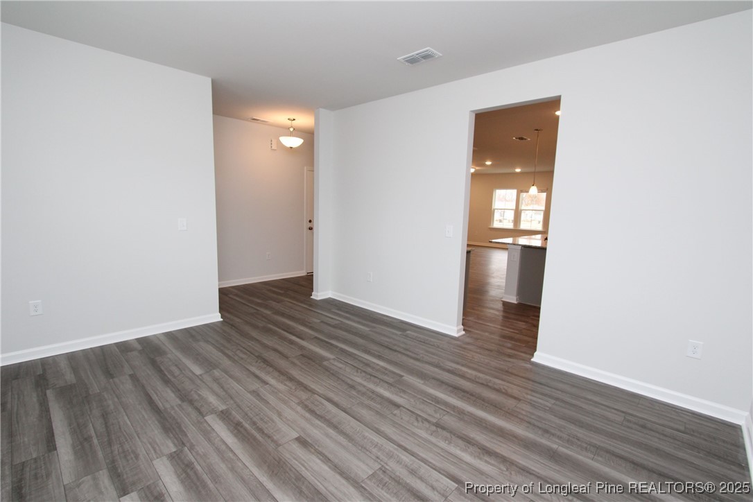 461 Grange Farm Place Raleigh, NC 27603 - Photo 5 of 50 wooden floor in an empty room with a window