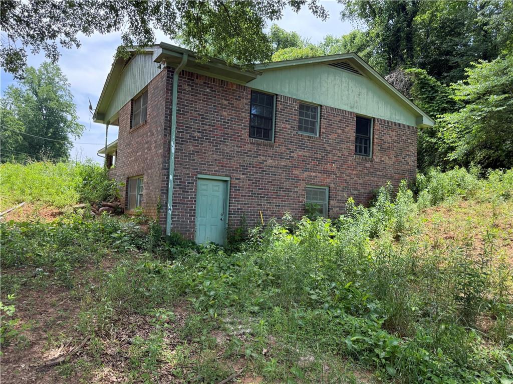 5075 Karr Road Cumming, GA 30040 - Photo 10 of 38 a front view of a house with a yard