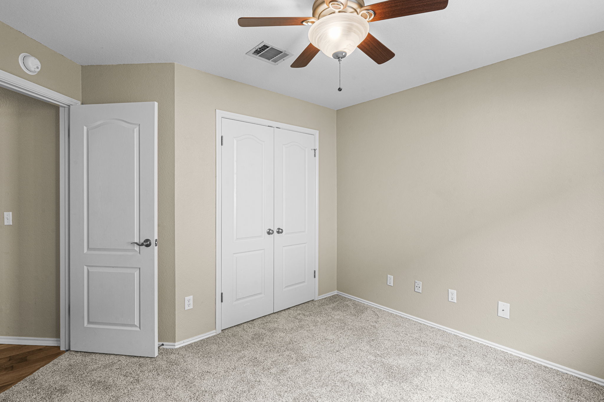 7172 Ridge Oak Road Austin, TX 78749 - Photo 37 of 40 Well-appointed bedroom with plush carpeting, offering a comfortable retreat.