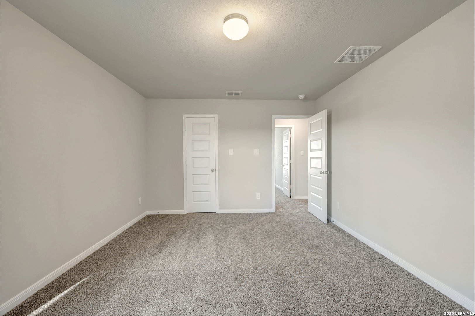 10330 Goodison Drive Converse, TX 78109 - Photo 34 of 42 an empty room with a empty space and windows