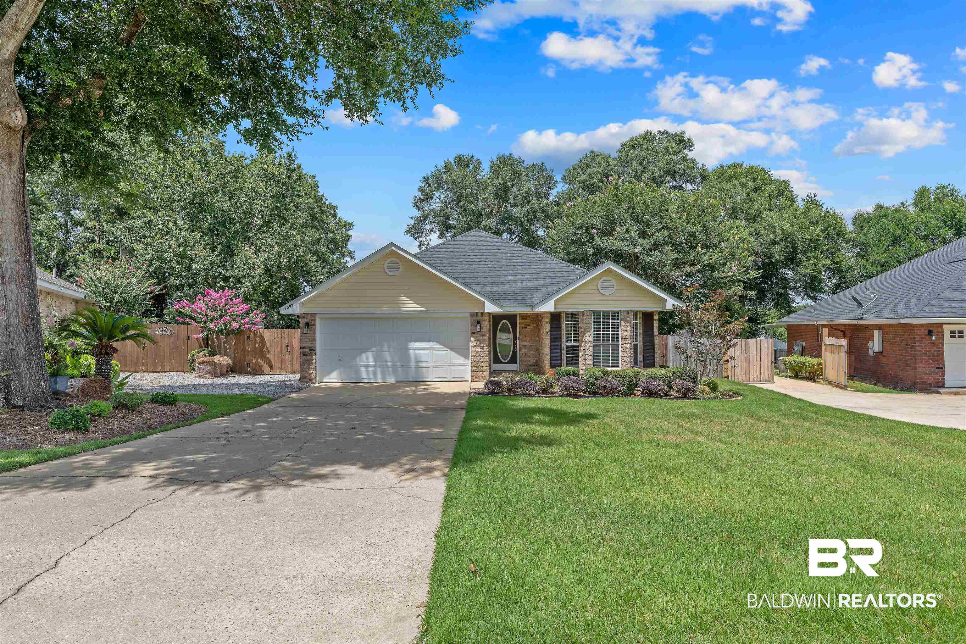 11097 Pontchartrain Loop Daphne, AL 36526 - Photo 4 of 28 Single story home featuring brick siding, a garage, and driveway
