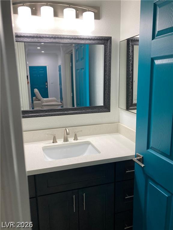 9050 West Warm Springs Road, Unit 1027 Las Vegas, NV 89148 - Photo 24 of 44 A well-appointed bathroom features a sleek vanity and modern fixtures, ready for daily routines.