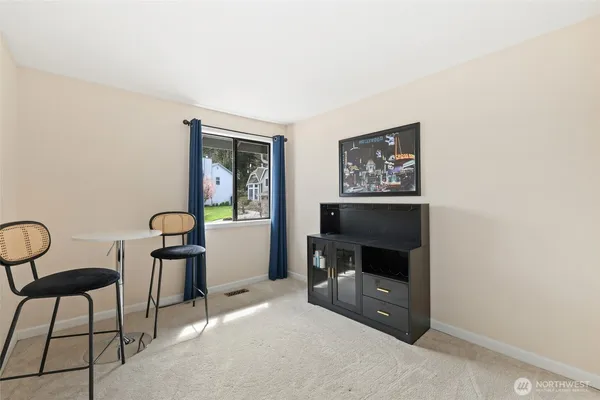 a room with a chair and a fireplace