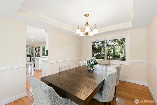 a view of a dining room with furniture and wooden floor