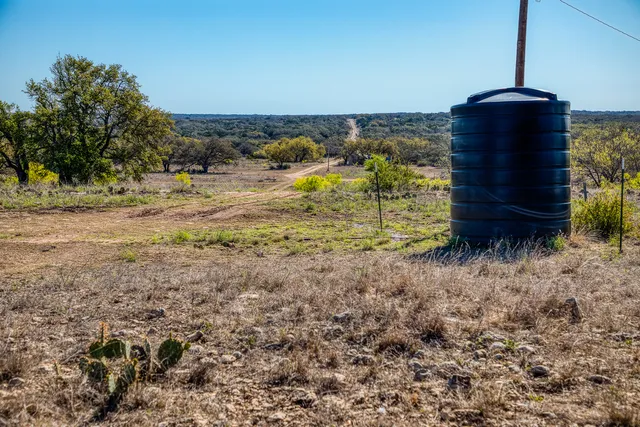 a view of a yard with an ocean view