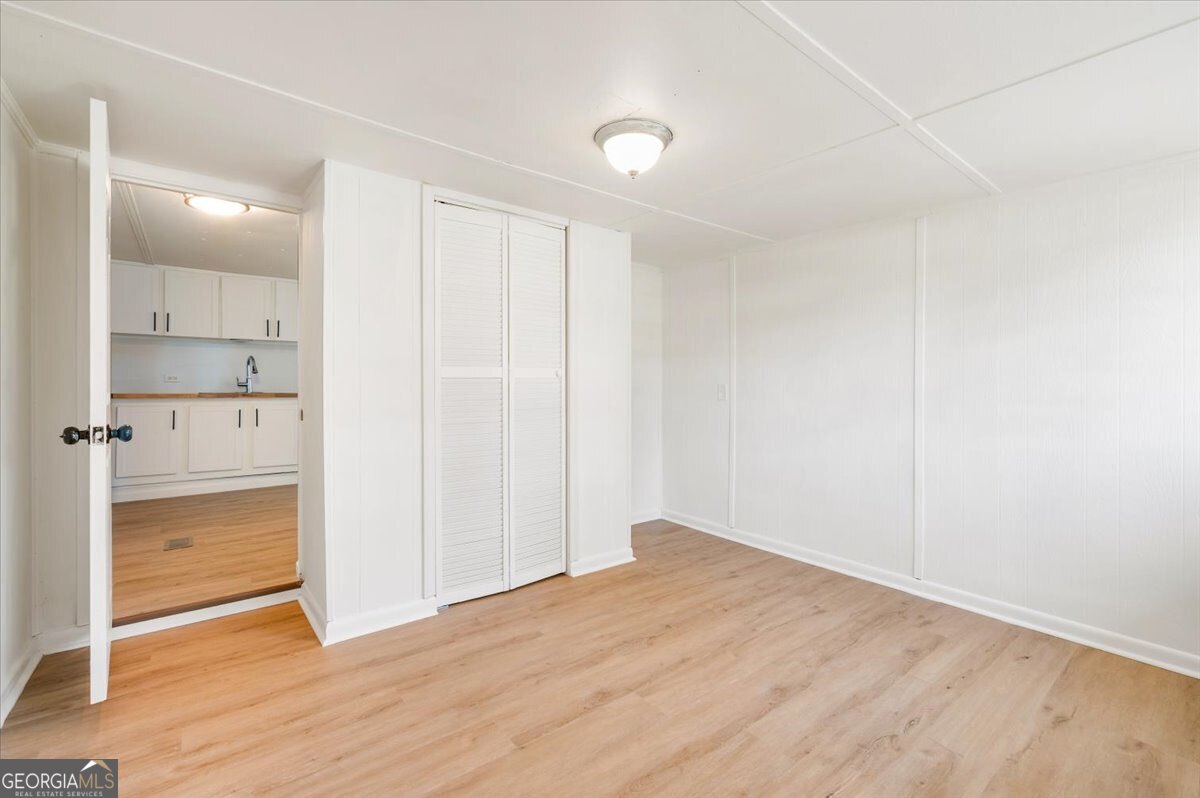 24 Sangster Road Jesup, GA 31545 - Photo 13 of 35 a view of empty room with wooden floor