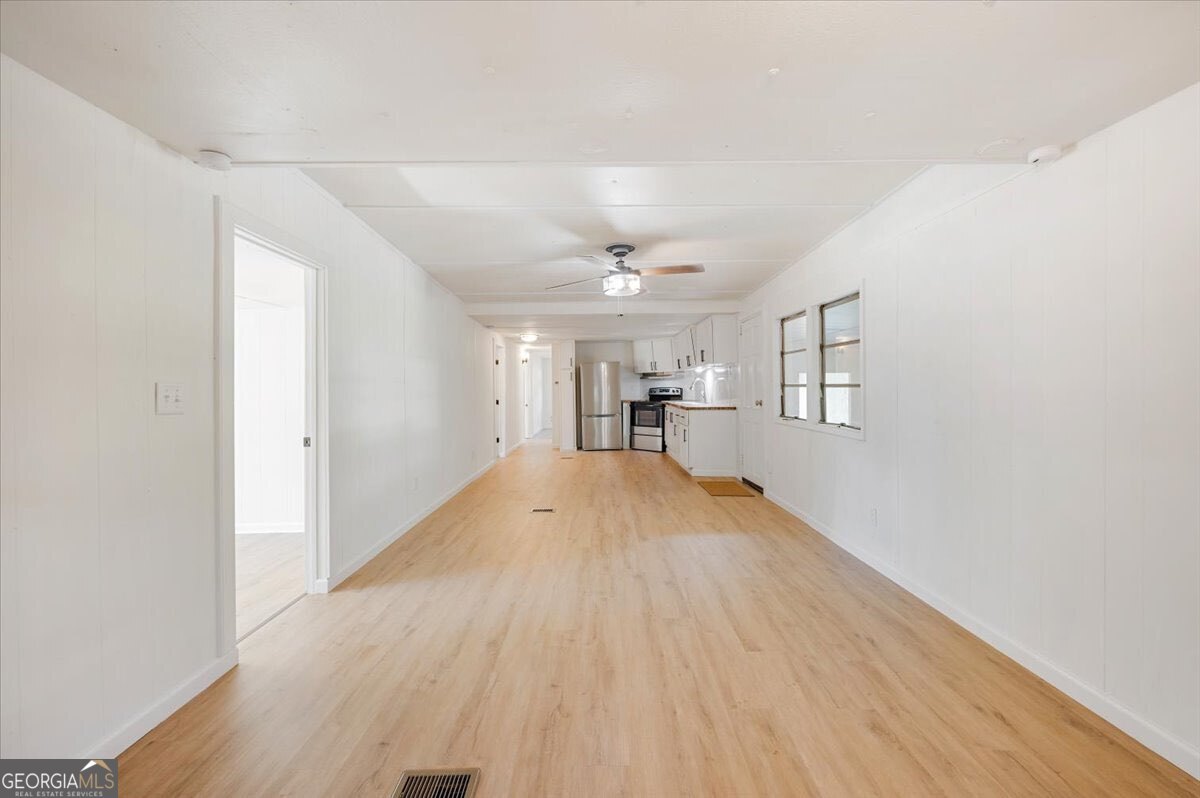 24 Sangster Road Jesup, GA 31545 - Photo 21 of 35 a view of empty room with wooden floor