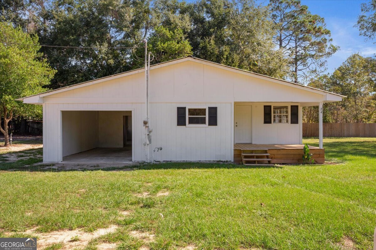 24 Sangster Road Jesup, GA 31545 - Photo 6 of 35 a view of house with backyard