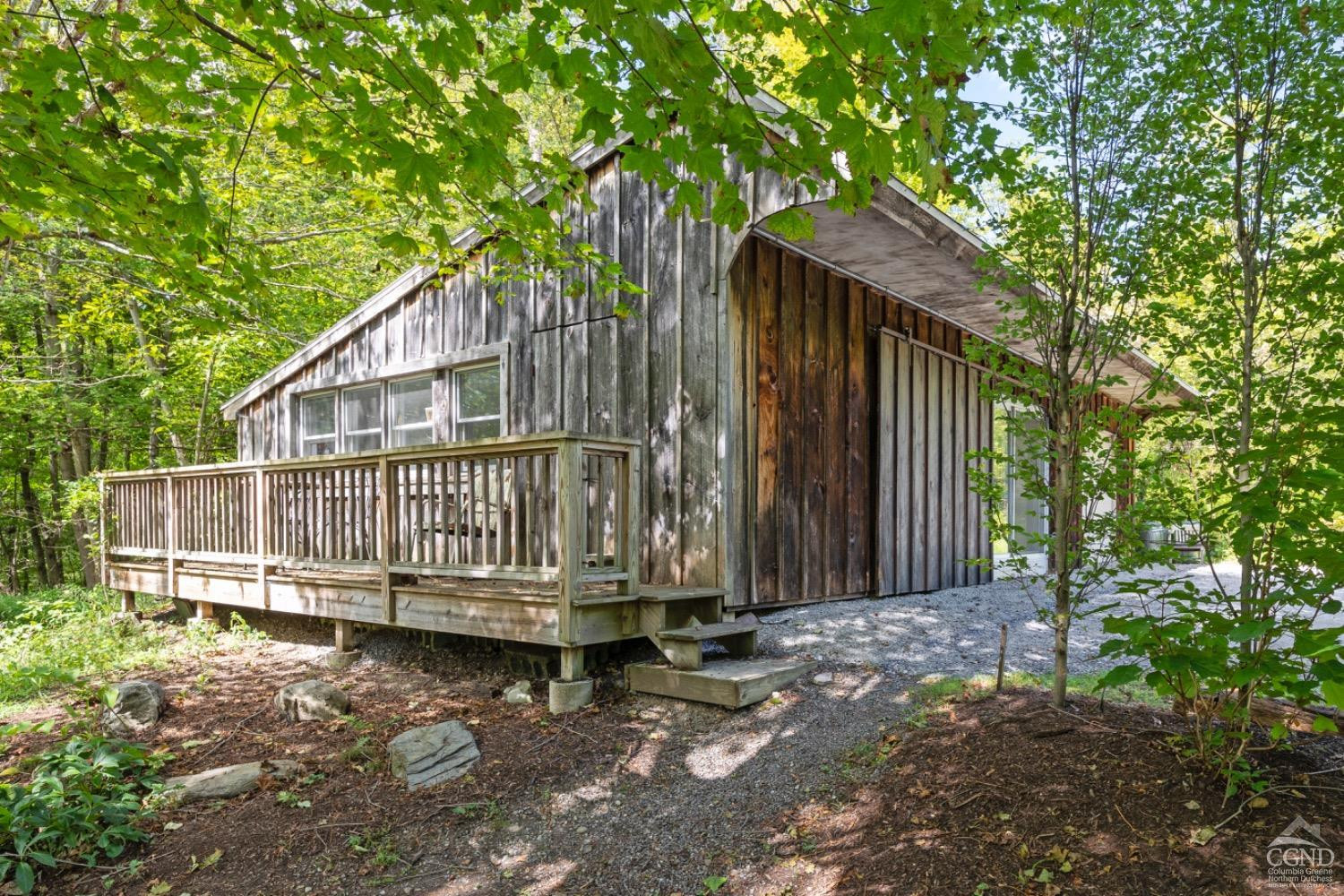 1487 County Rte 27 Craryville, NY 12521 - Photo 26 of 27 a backyard of a house with a small deck