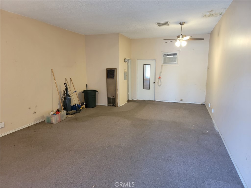 2024 Mountain Avenue Duarte, CA 91010 - Photo 3 of 5 an empty room with chandelier fan and windows