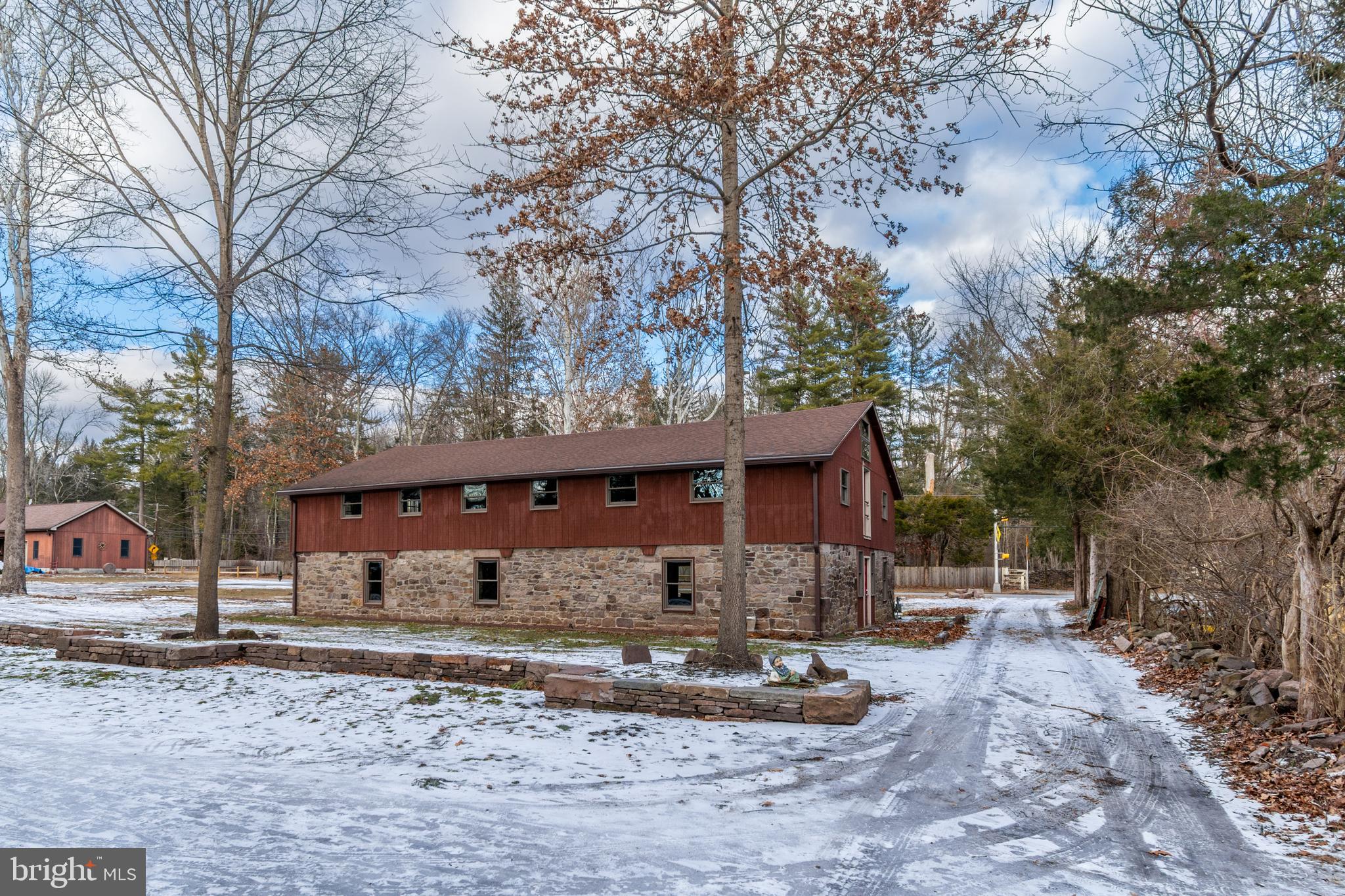 25 Risler Street Stockton, NJ 08559 - Photo 23 of 36 a view of a house with a yard covered with snow