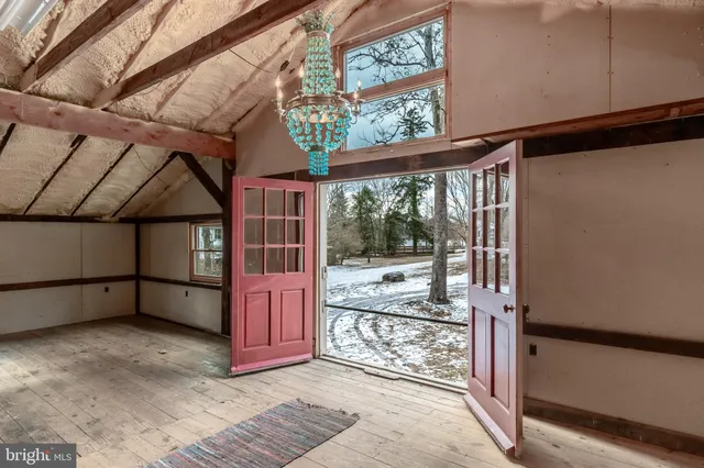 a view of a room with wooden walls