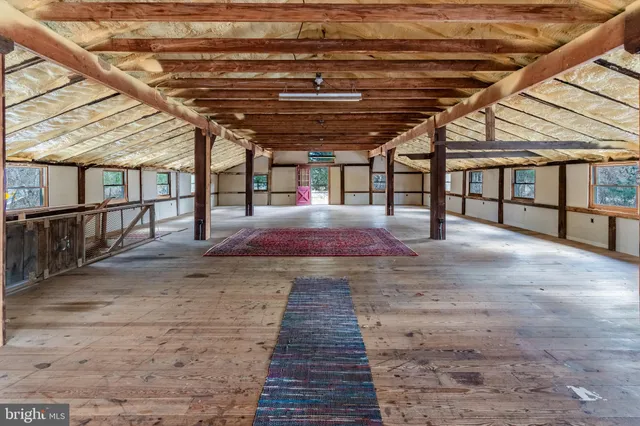 a view of a hallway with stairs