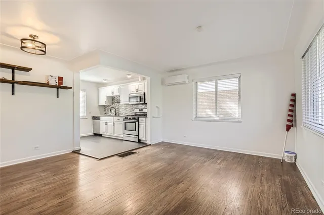a view of kitchen with furniture and wooden floor