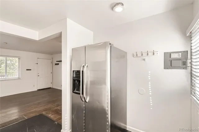 a bathroom with a shower and a glass door