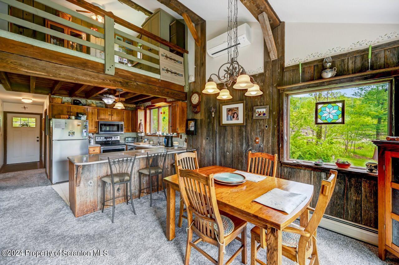 33 Hobbs Road Tunkhannock, PA 18657 - Photo 18 of 83 a view of a patio with a table and chairs and potted plants
