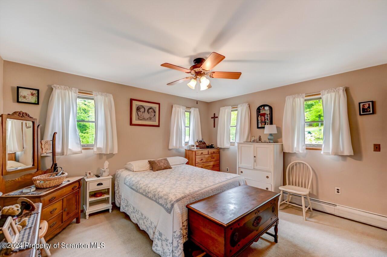 33 Hobbs Road Tunkhannock, PA 18657 - Photo 49 of 83 a bed room with a bed and a chandelier