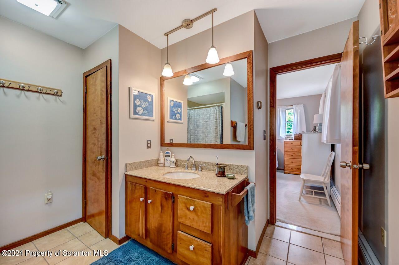 33 Hobbs Road Tunkhannock, PA 18657 - Photo 54 of 83 a bathroom with a sink and a mirror