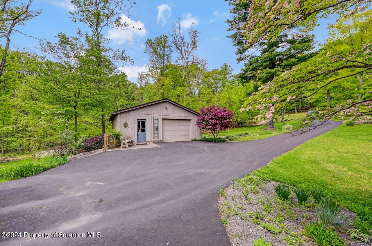 33 Hobbs Road Tunkhannock, PA 18657 - Photo 6 of 83 a front view of a house with a yard and garage
