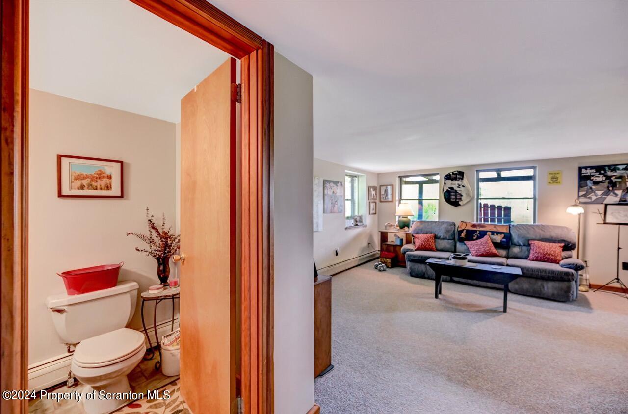 33 Hobbs Road Tunkhannock, PA 18657 - Photo 61 of 83 a living room with furniture and a potted plant