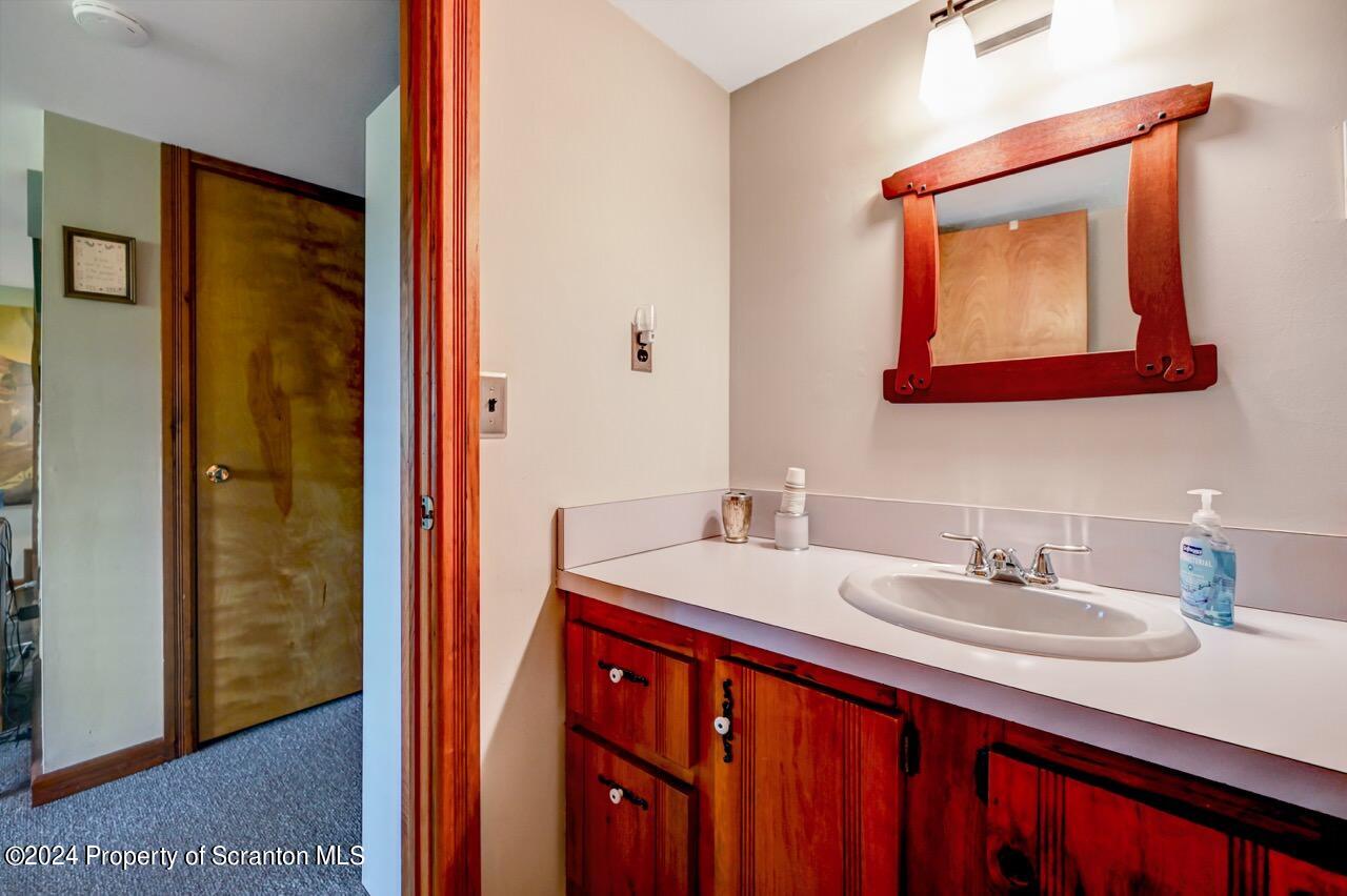 33 Hobbs Road Tunkhannock, PA 18657 - Photo 68 of 83 a bathroom with a sink vanity and a mirror