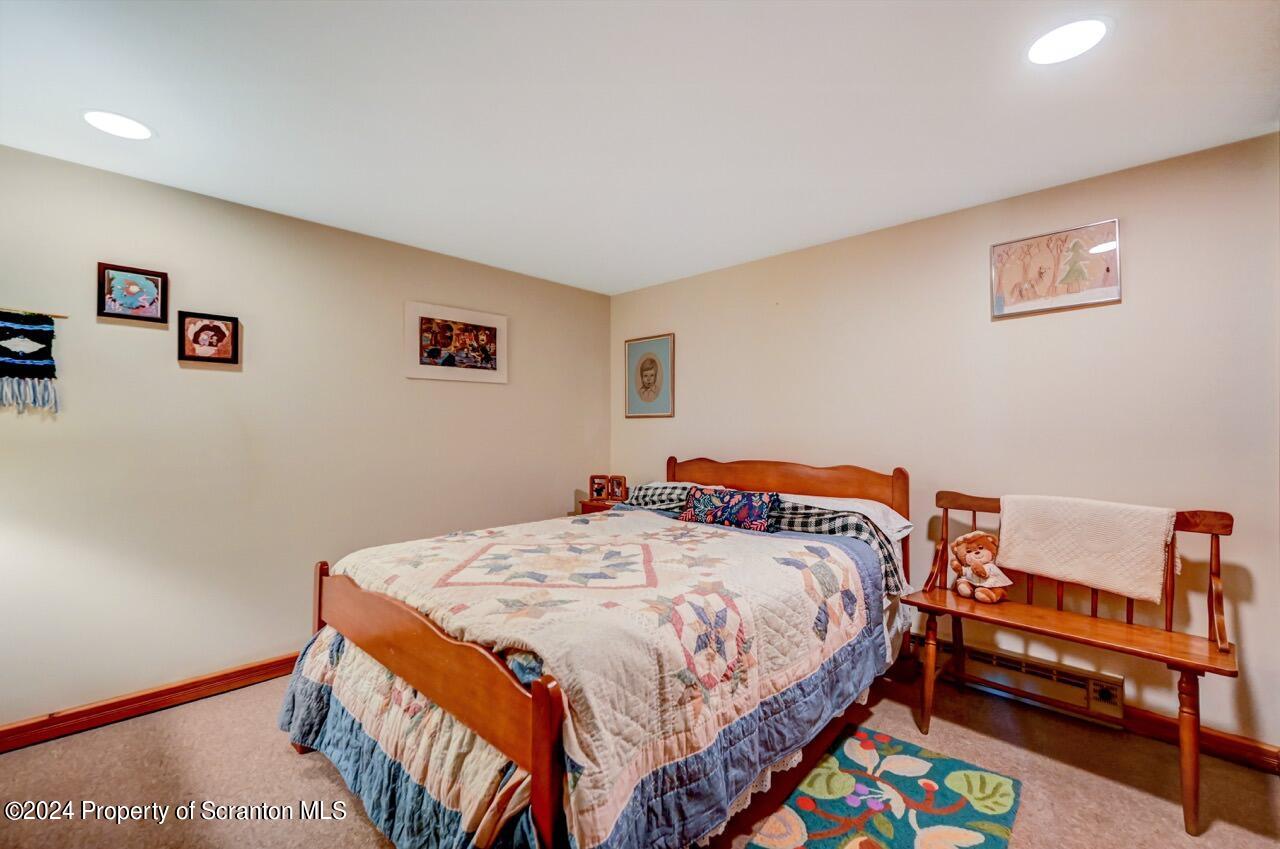 33 Hobbs Road Tunkhannock, PA 18657 - Photo 69 of 83 a bedroom with a bed and a workspace