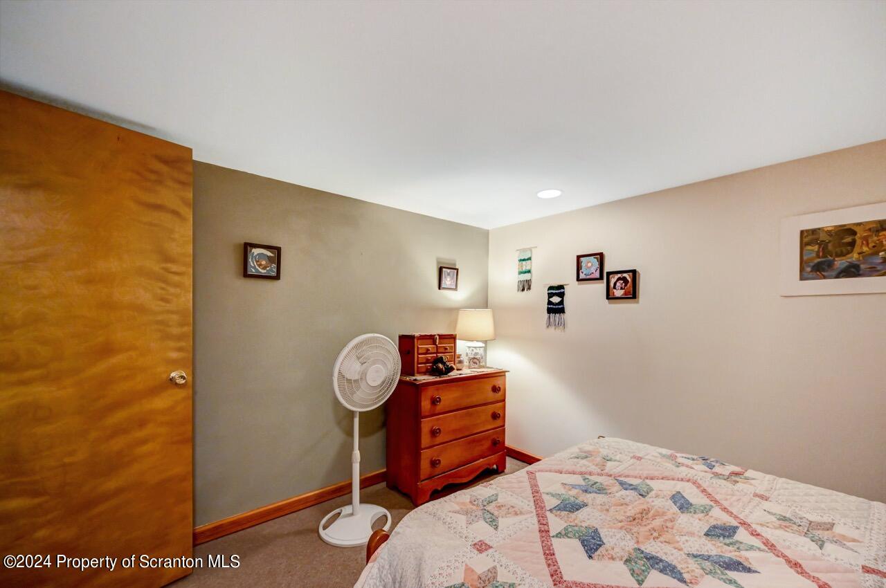 33 Hobbs Road Tunkhannock, PA 18657 - Photo 71 of 83 a bedroom with a bed and cabinets
