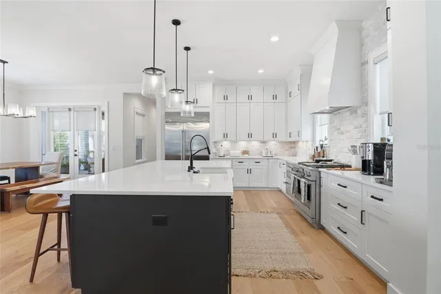 a spacious bathroom with a bathtub and sink