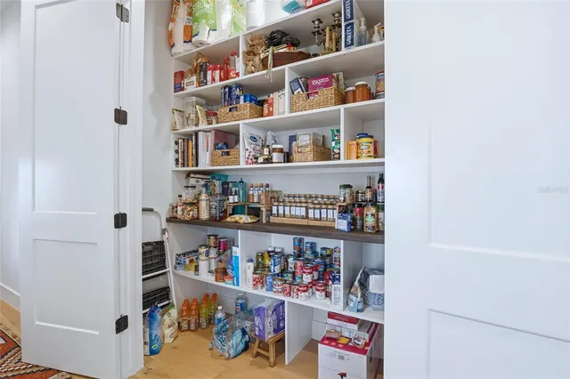 a living room with furniture a air conditioner and a window