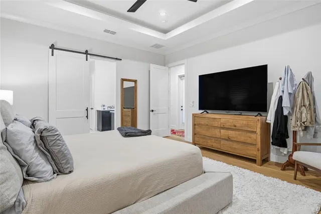 a bathroom with double vanity and a mirror
