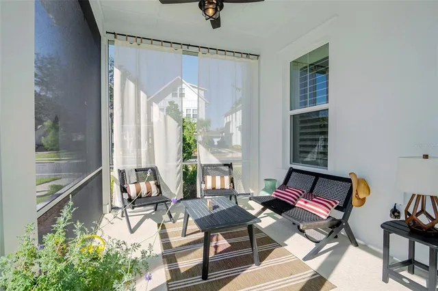 a living room with furniture fireplace and flat screen tv