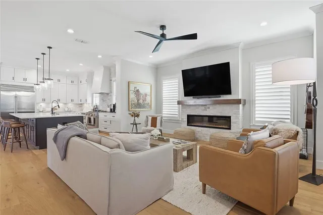 a kitchen with stainless steel appliances kitchen island granite countertop a chairs and a chairs