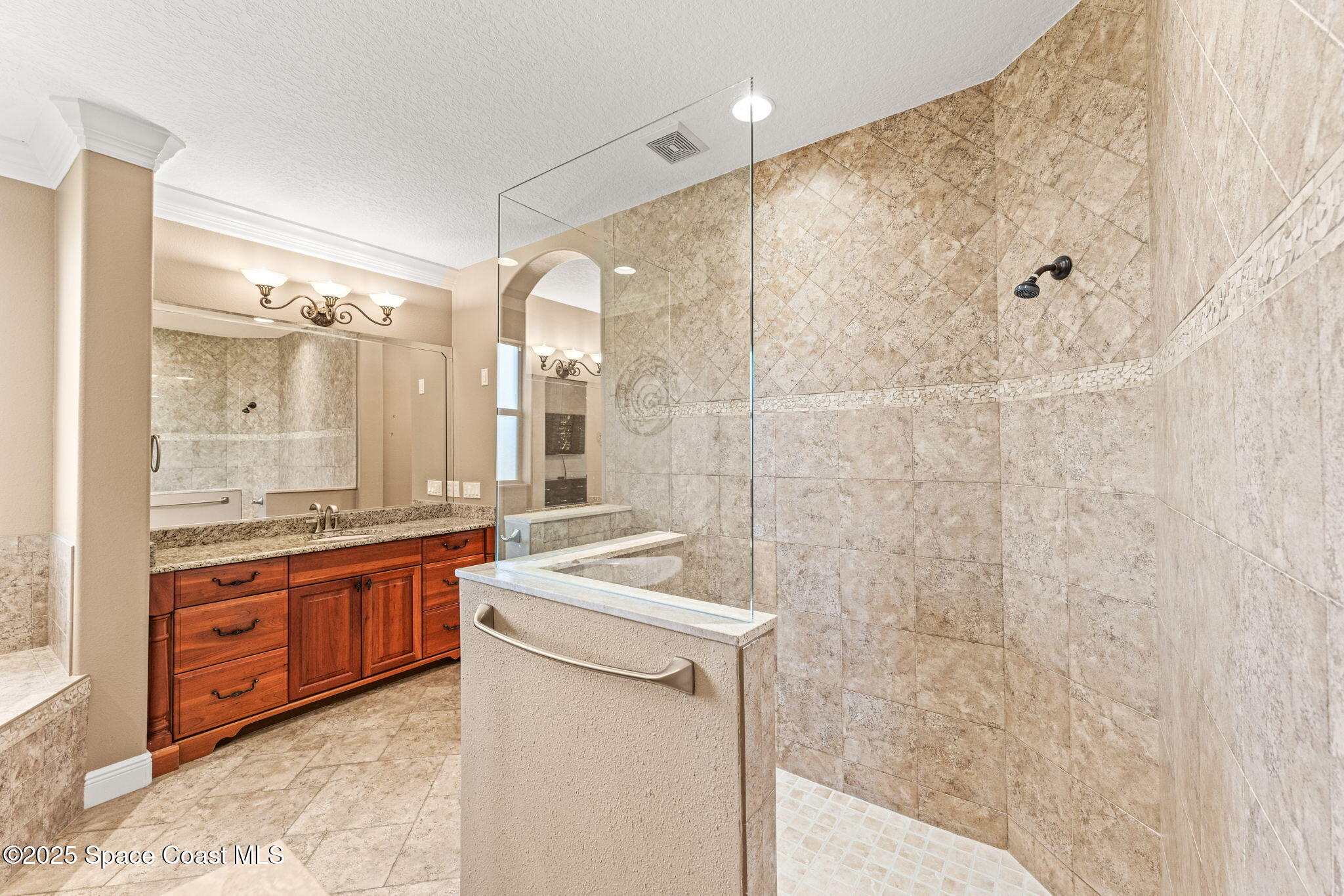 3152 BELLWIND Circle Rockledge, FL 32955 - Photo 23 of 47 a bathroom with a granite countertop sink a toilet a mirror and shower