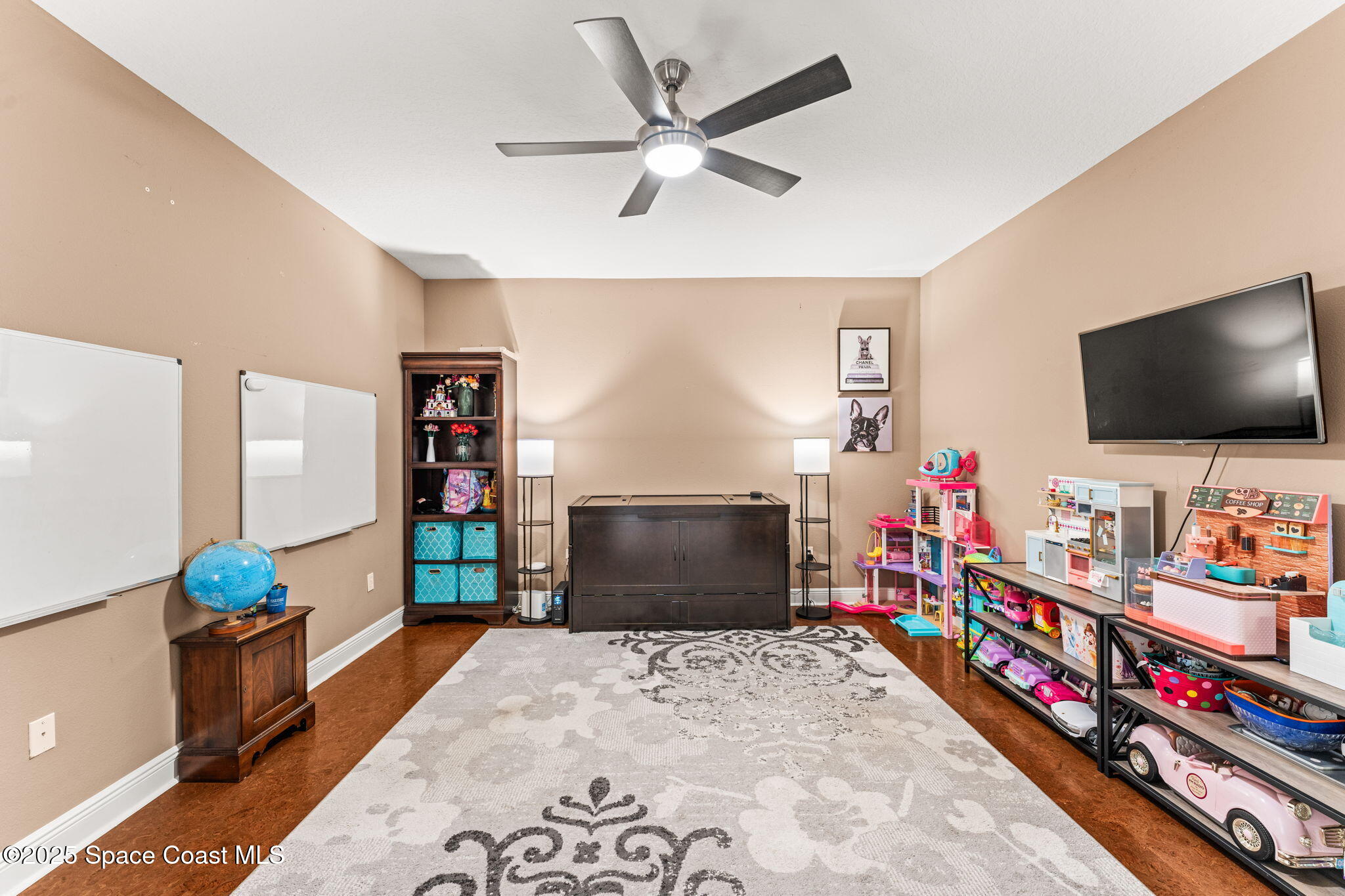 3152 BELLWIND Circle Rockledge, FL 32955 - Photo 30 of 47 a living room with furniture and a flat screen tv